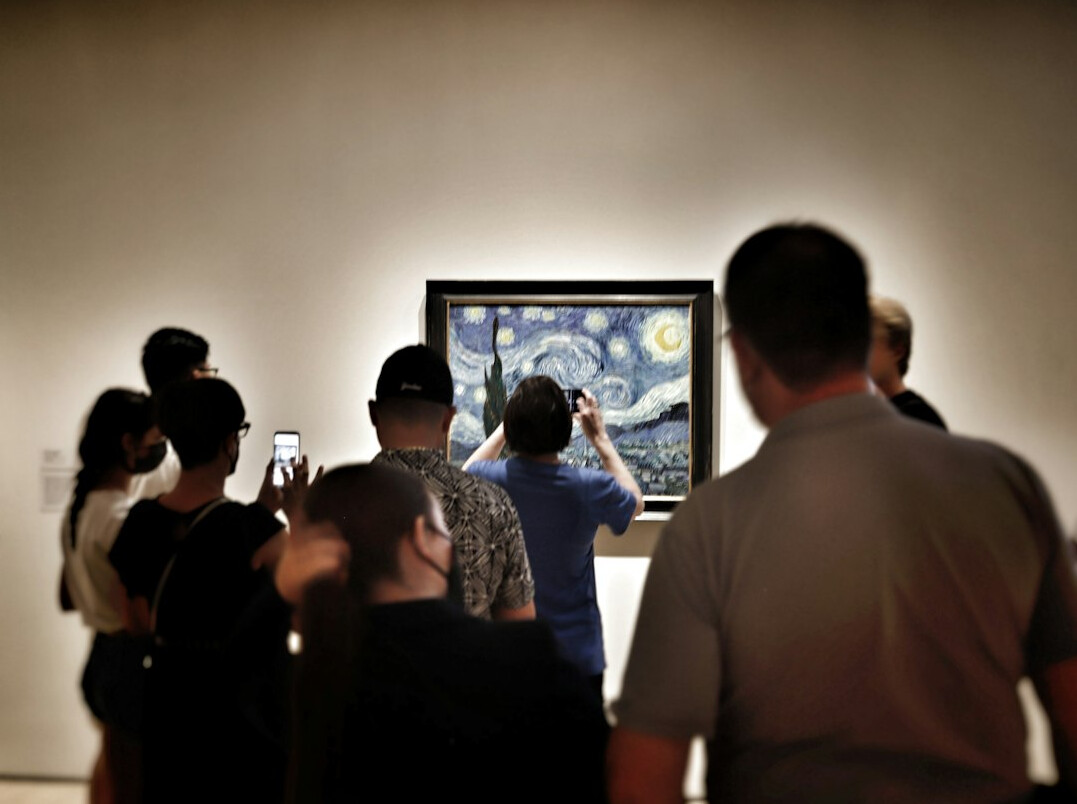 Marketing team reviewing a media campaign on a screen